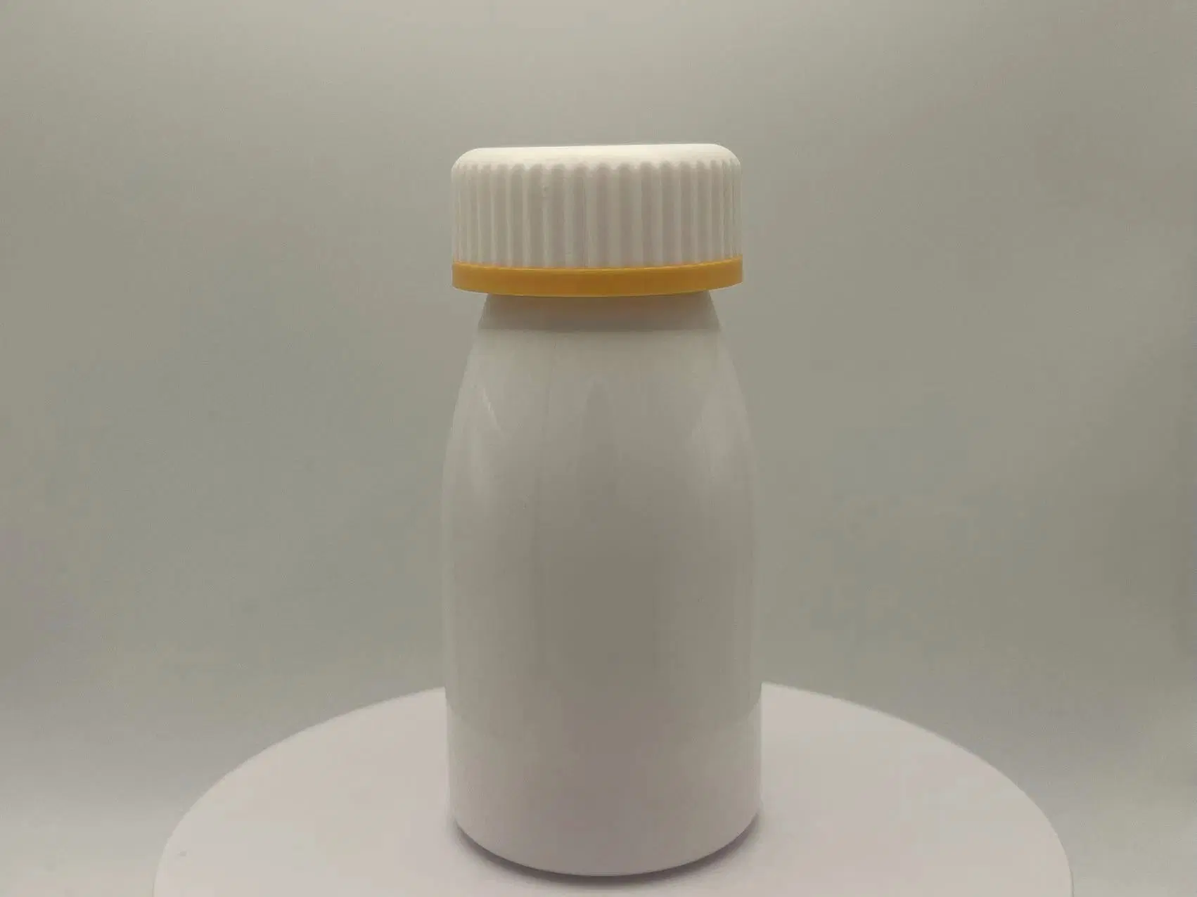 PET 200ml brillante amarillo Blanco Doble capa tapa de hoja Láctea Forma de leche Blanca botella de plástico para el cuidado de la salud