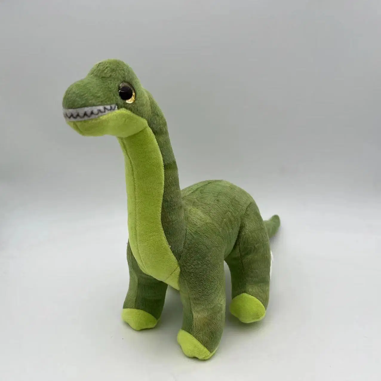 Jouet en peluche debout en gros de simulation réaliste de dinosaure en peluche pour animaux de compagnie.
