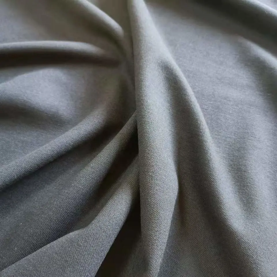 Manufacture Wholesale/Supplier Stock Twill Plain Dyed Knitted Fabric Polyester Tr Ponte De Roma Fabric for Dress Pants Garment