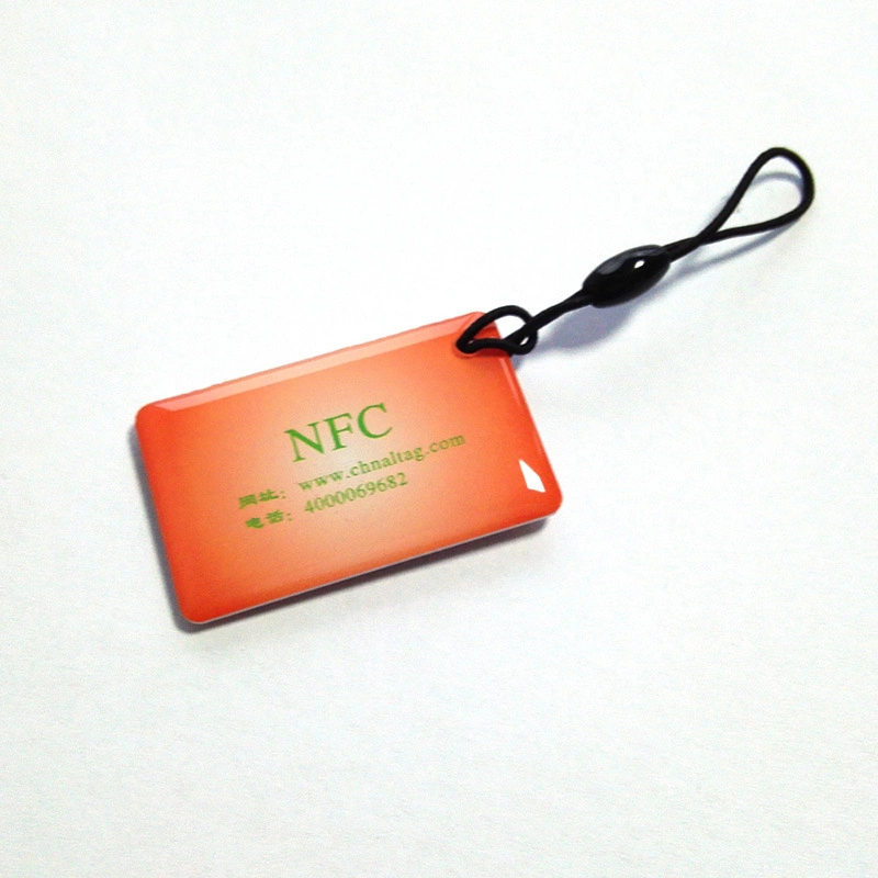 El cliente hizo Ntag Hangtag213 Ntag215 Ntag216 con el logotipo de la NFC fuerte de la etiqueta de epoxi