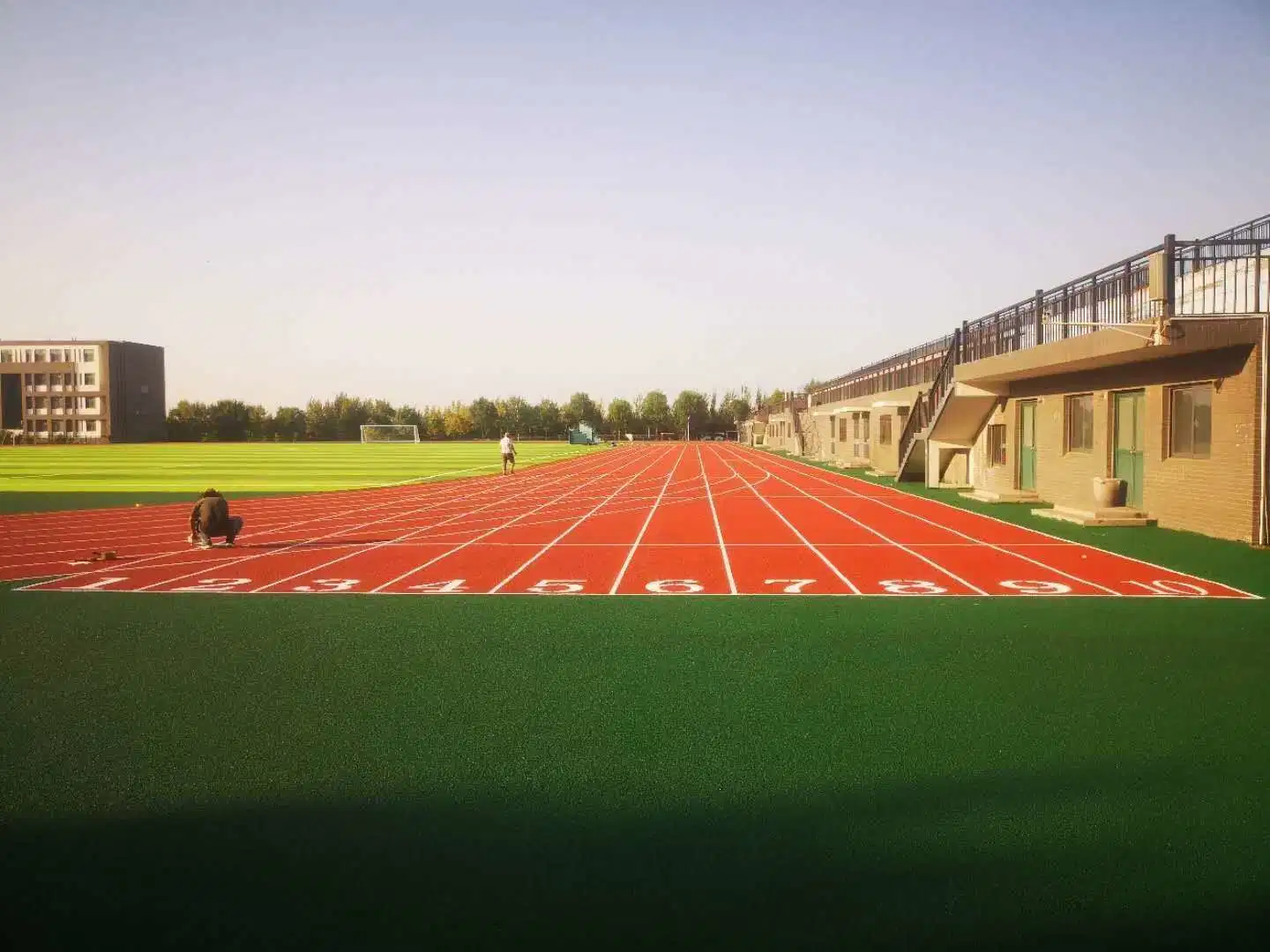 The Two Layer Sandwich System Running Track Consists of SBR Base Rubber Crumb Material Mixed Onsite with Polyurethane Binder and EPDM Rubberized Running Track