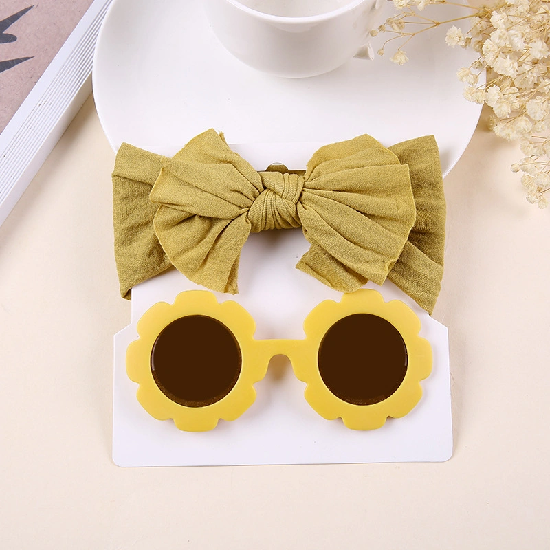 O bebé Toddler Headdress Girl Bow Sweat-Absorbing ajustável e o conjunto de óculos