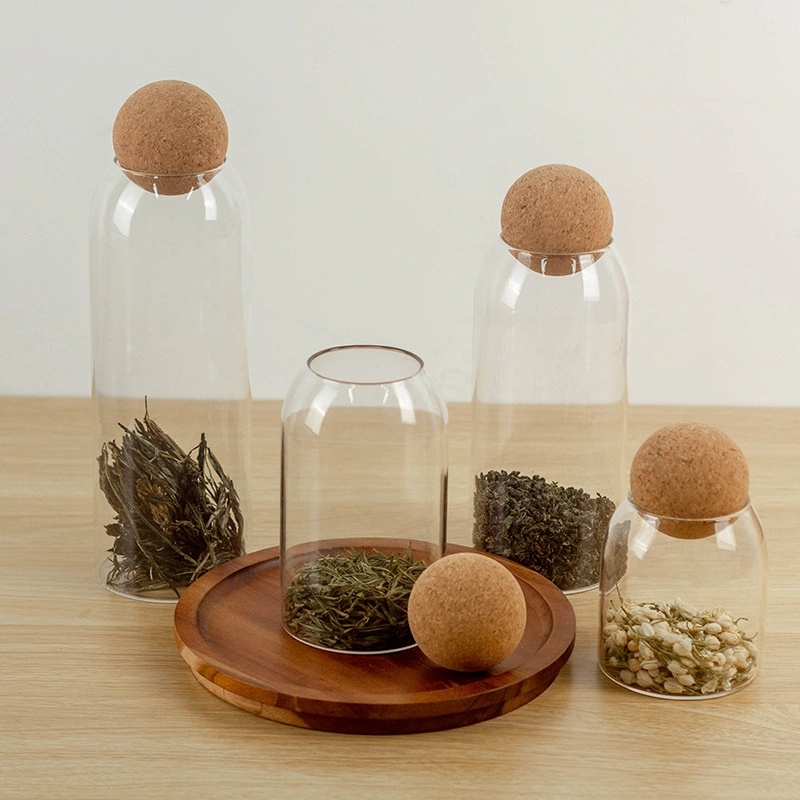 Ensemble de pots de rangement en verre rond pour épices et café avec couvercle en bois scellé en forme de boule pour les aliments.