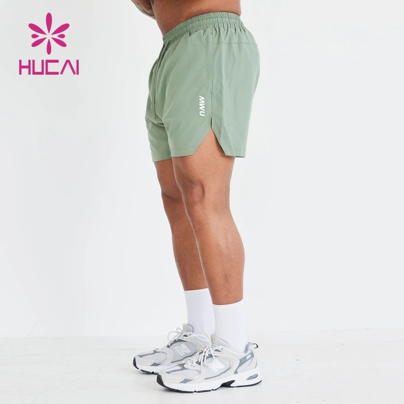 ODM Étiquette privée Sports Vente chaude Shorts de gym pour hommes avec poche pour téléphone, séchage rapide, respirant, impression d'écran.