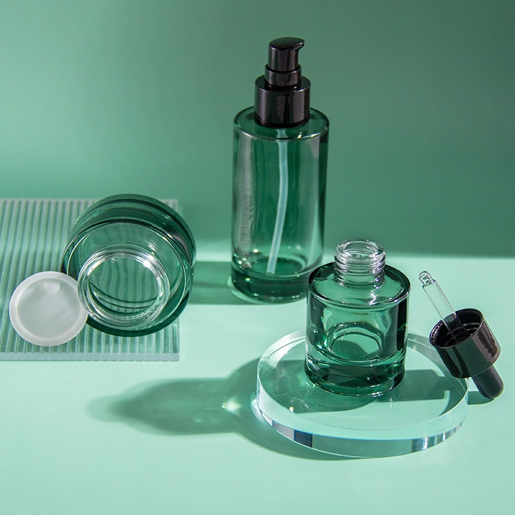 Luxury Custom Skincare Packaging Green Cosmetic Glass Bottle Set Skin Care Packaging Glass Container Jar Sets