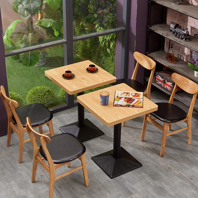 High quality/High cost performance  Wooden Western Restaurant Furniture Dining Table and Chairs Square with Metal Base Solid Wood Frame Chair with Leather Seater