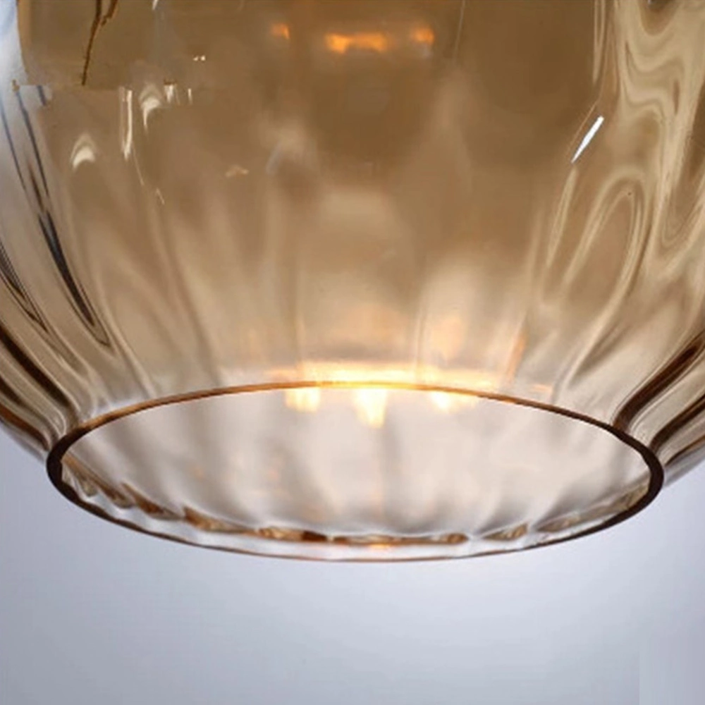 مصباح الثريا الحديثة بأسلوب نورديك فاخر بتصميم قطرة ماء، جزيرة من الحديد الأسود وزجاج مزخرف.
