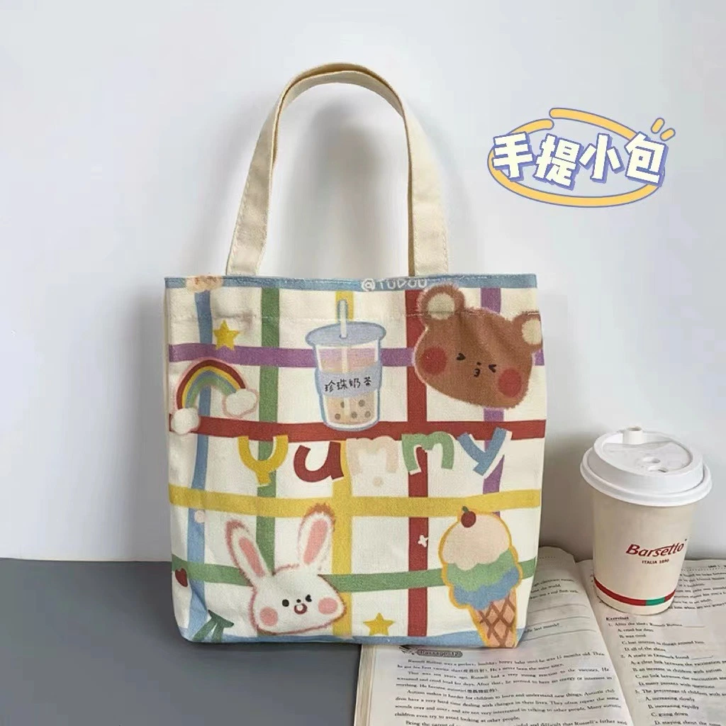 Wholesale/Supplier Kids' High quality/High cost performance  Fashionable Cartoon Print Colour Canvas Tote Bag Shopping Bag for Student Lunch Cylinder Bento Bag