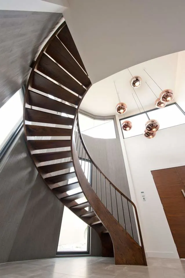 Interior Curved Staircase with Wrought Iron Balustrade