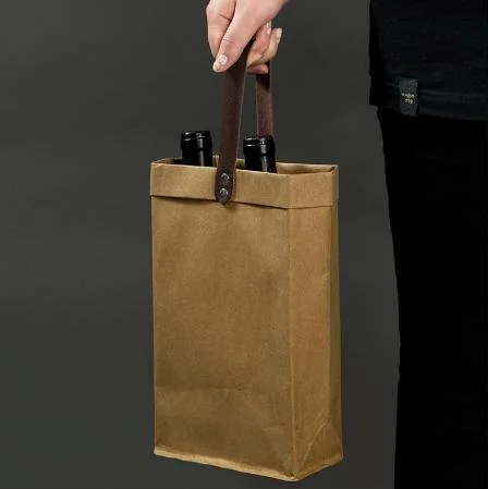 Chine en gros Écologique Logo personnalisé Impression Kraft Lavable 100% Sacs à vin en papier réutilisables avec poignées en cuir PU