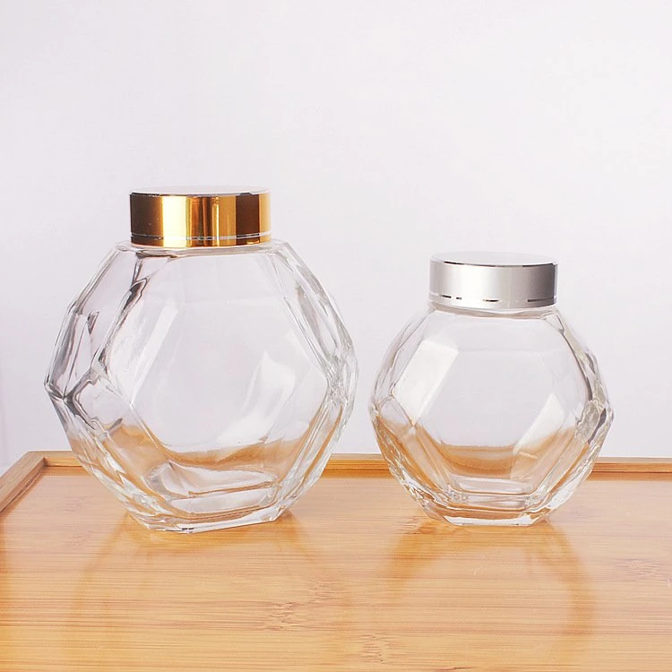 Großhandel Hexagon Wabe Glas Container Aufbewahrungsflasche mit Metalldeckel Lebensmittelaufbewahrung Flasche Glas Honig Glas