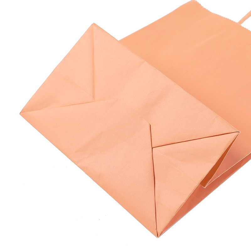 حقيبة ورق تغليف باللون البرتقالي مع تصميم مخصص