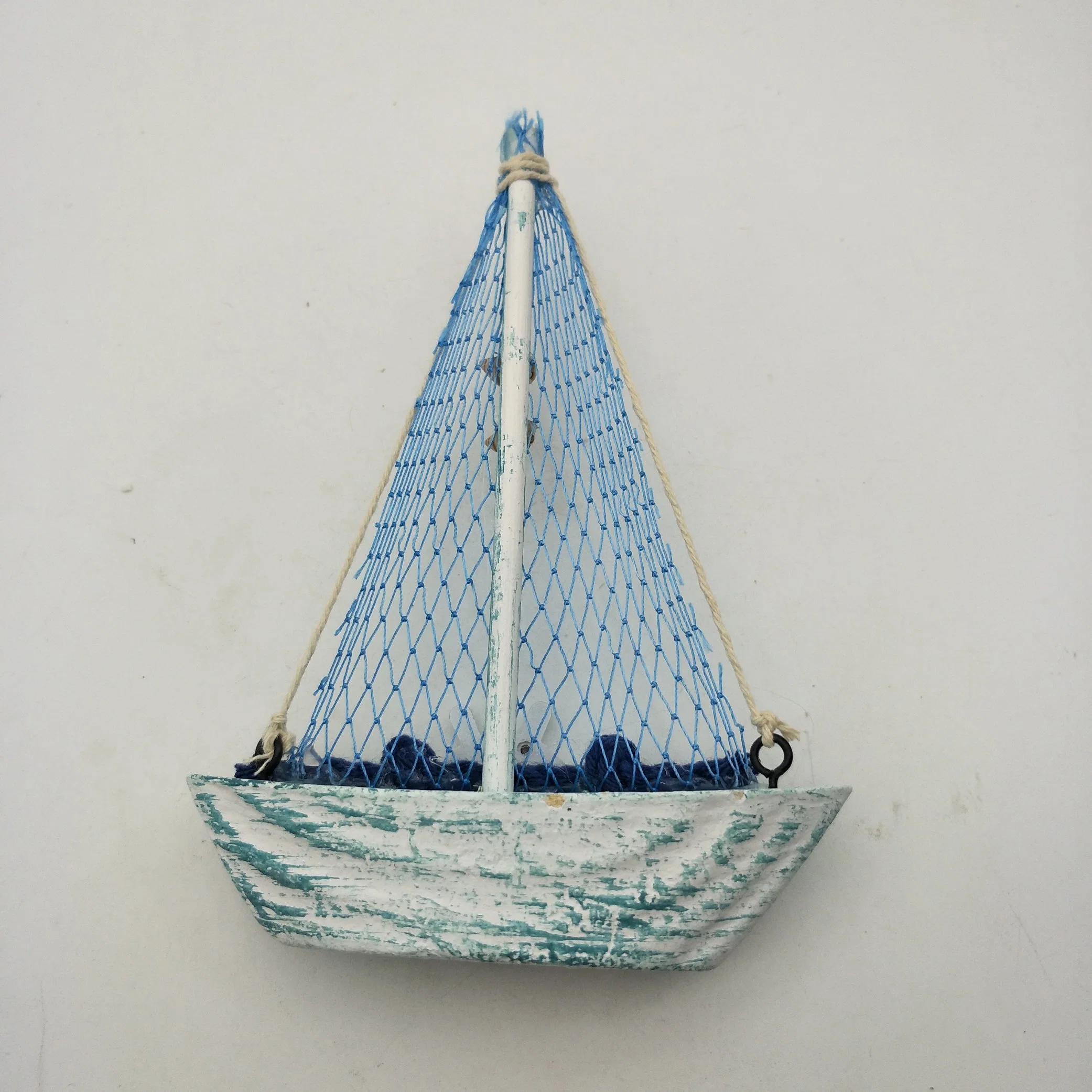 Blue Wooden Sailboat with Fishing Net