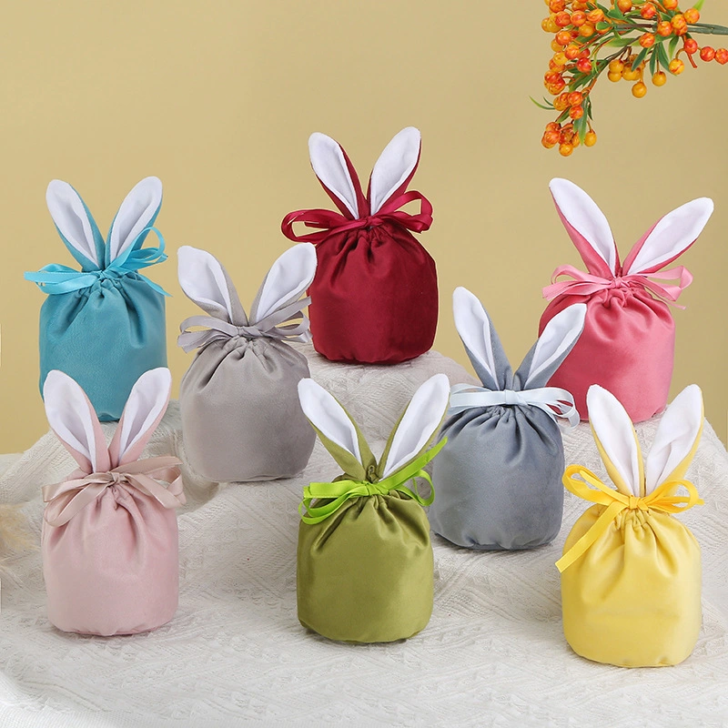 La Pascua Regalos y artesanías de conejito de peluche de caramelos de colores bolsa de regalo en el oído del conejo de chocolate