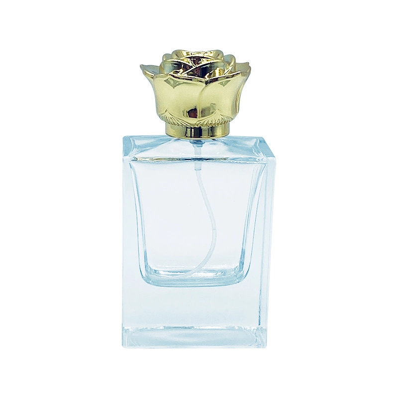 Luxury 50ml Clear Square Fragrance botella de perfume vacía de vidrio en aerosol Botella con tapón de flores de oro