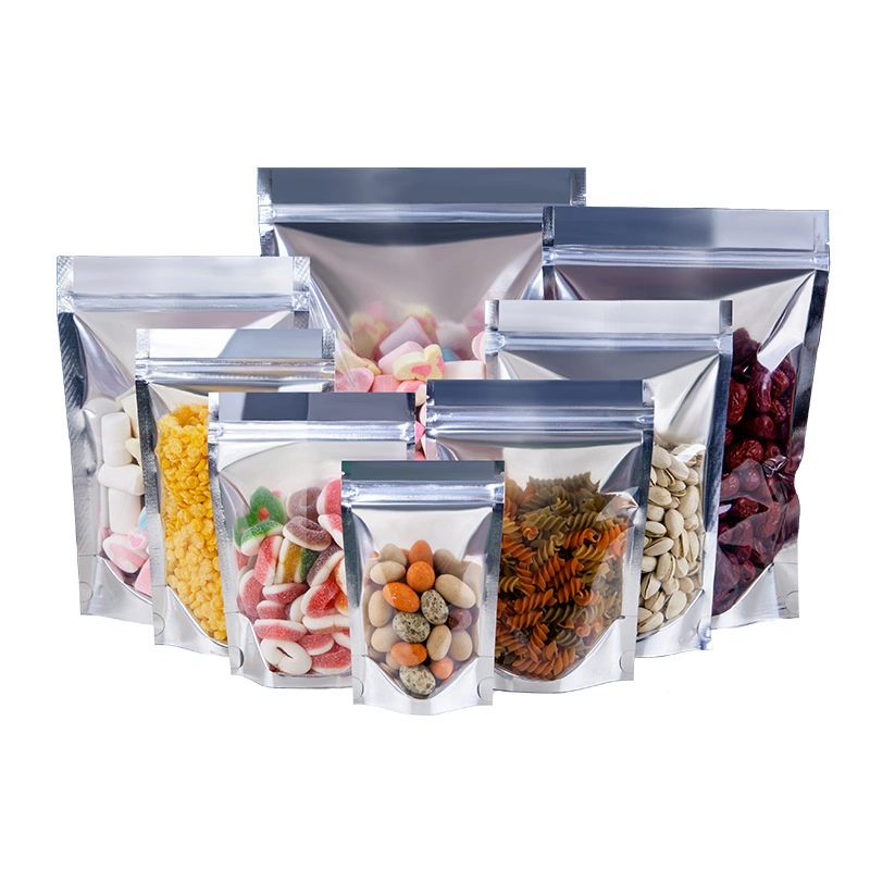 Sac d'emballage alimentaire Doypack avec fermeture refermable en aluminium transparent d'un côté pour fruits secs, noix, légumes et collations.