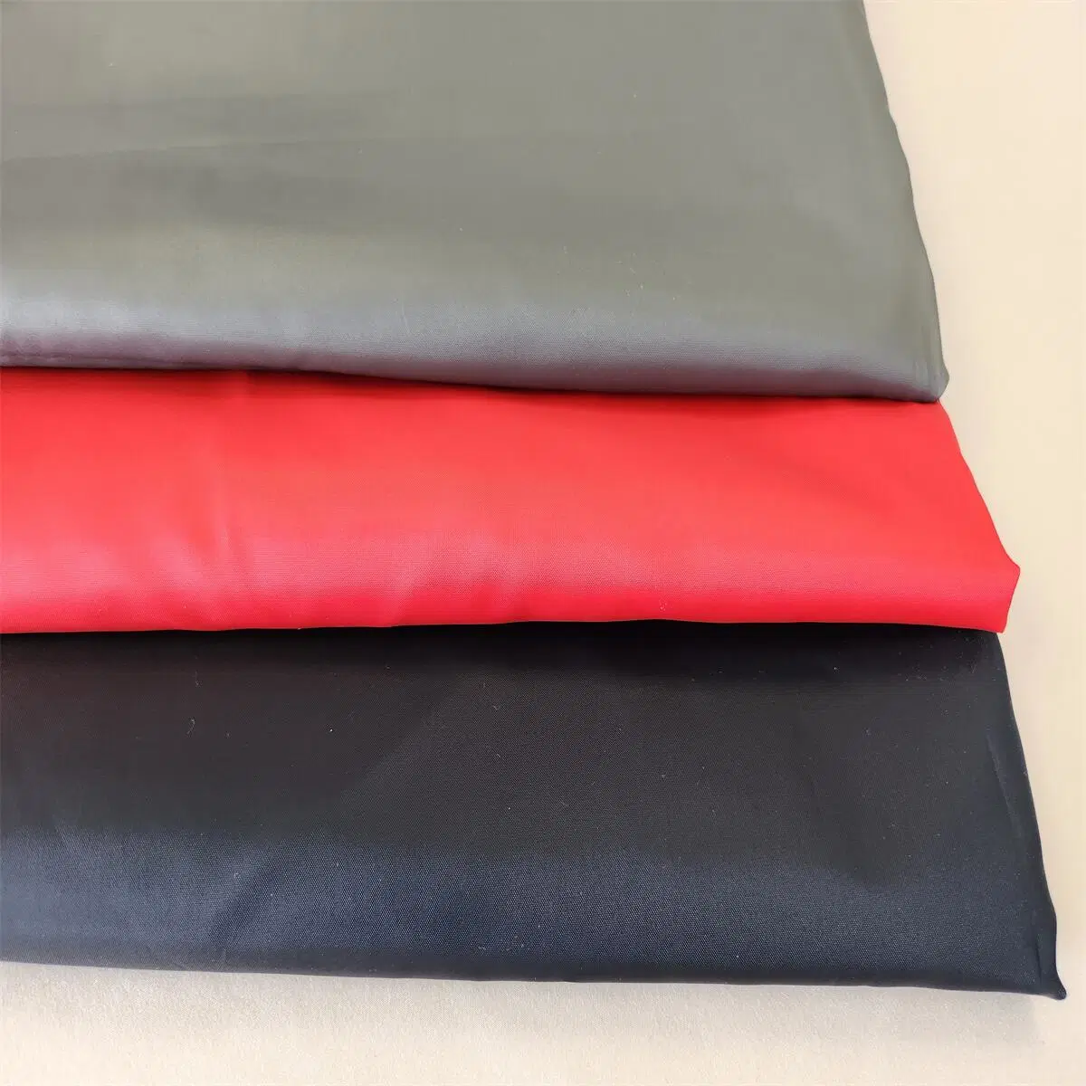 Customized Wholesale/Supplier 100% Polyester Embossed Taffeta Lining Textile Material Fabric
