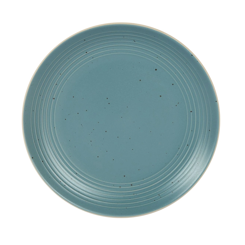 El gres vidriado en color azul con el punto de Spray Plato