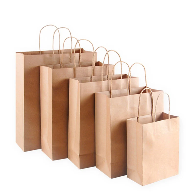 Cadeau de gros de vêtements personnalisés de l'emballage à emporter un sac de shopping sac de papier Kraft avec votre propre Logo