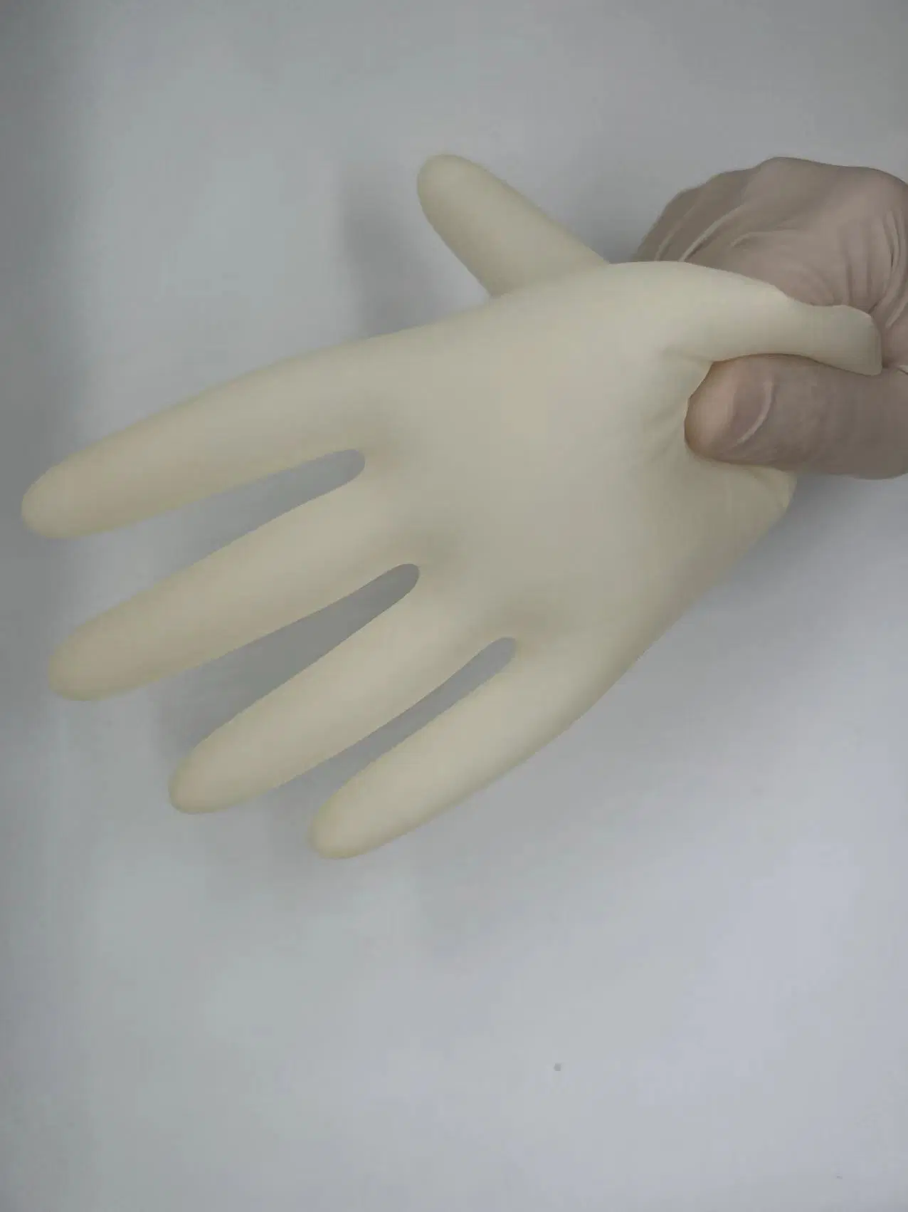 La mano en el hogar guante de látex envasados individuales Guantes de látex sin polvo, de colorear