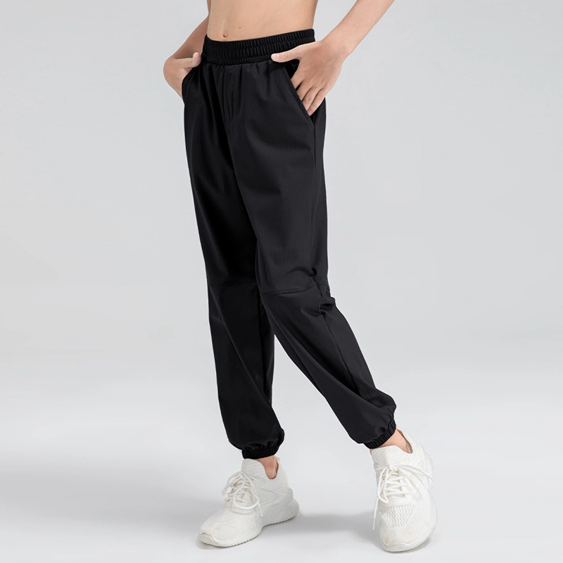 Pantalón de chándal informal de ajuste holgado con bolsillos laterales ligero para jóvenes Pantalón deportivo activo de secado rápido para niños