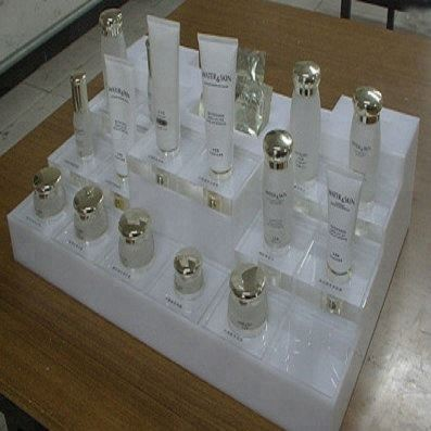 Exhibición acrílica de fábrica China para cosméticos utilizada en la superficie de la superficie