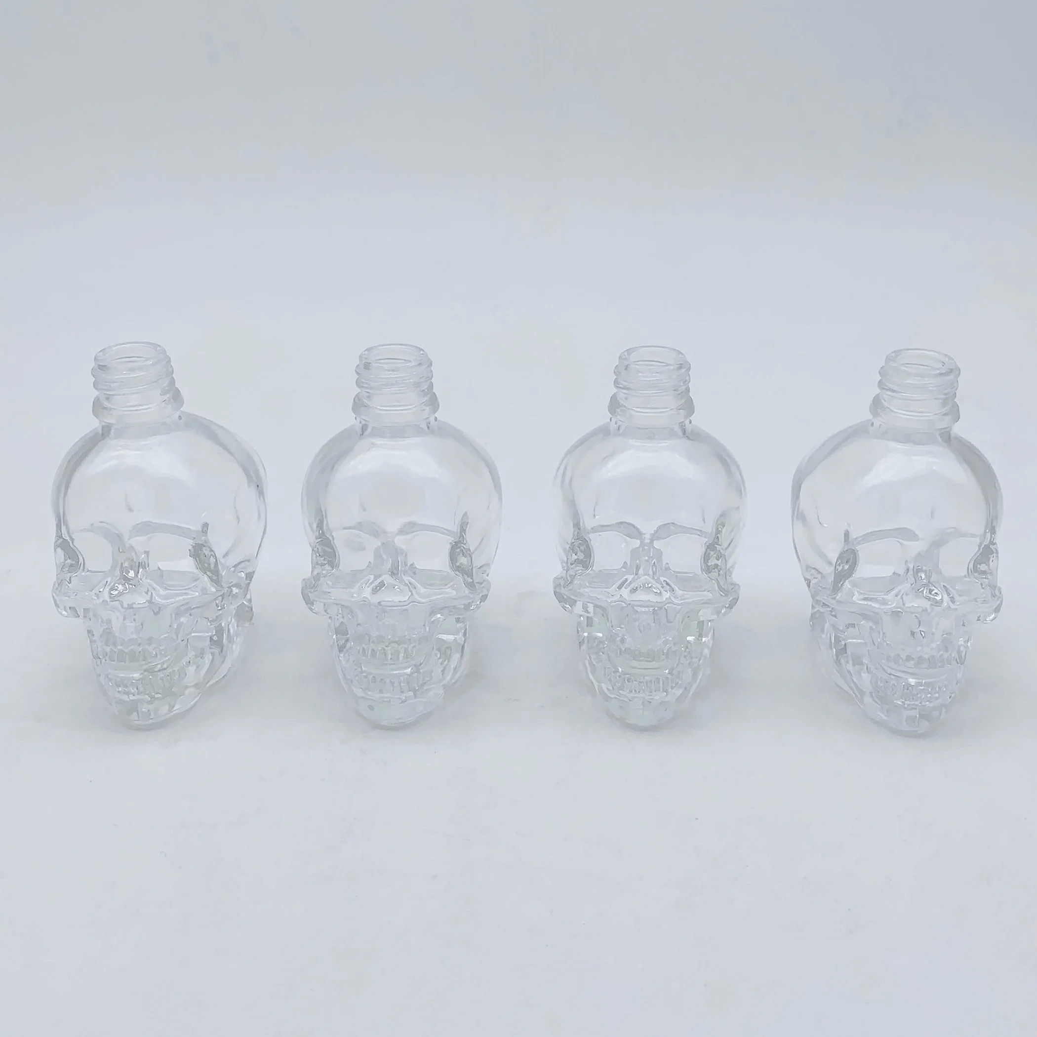 100ml Fashion Glass Bottle Shaped of Skulls Clear Transparent for Cosmetic Essential Oil Wine Bottles