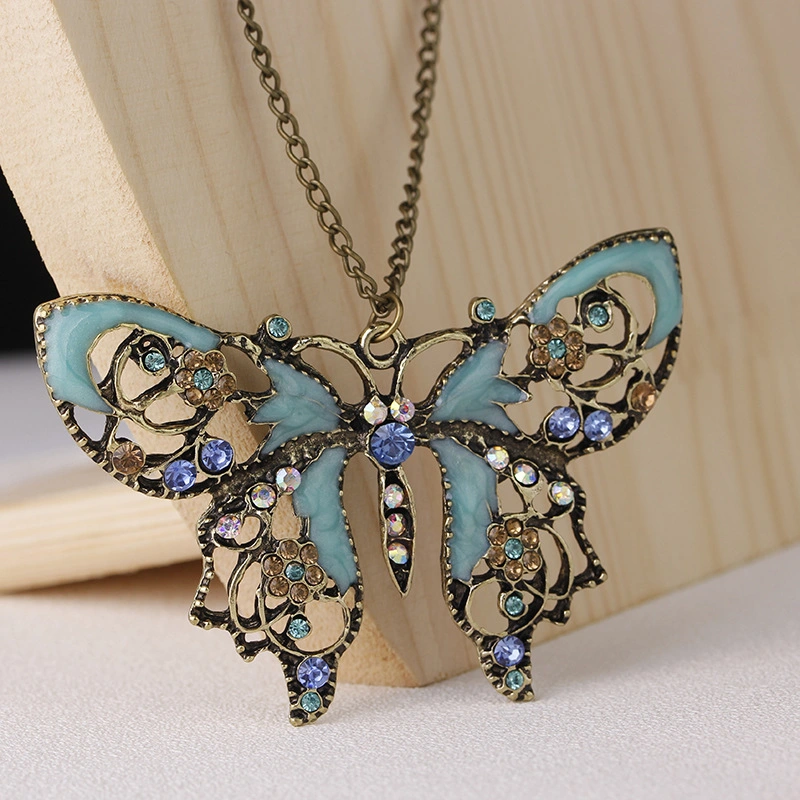 Manufacturer Wholesale/Supplier Jewelry Retro Hollow Oil Drip Butterfly Sweater Chain Necklace