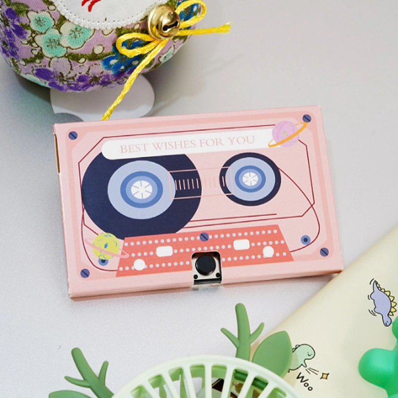 Carte de vœux enregistrable en forme de cassette audio avec voix personnalisée pour le jour de Noël.