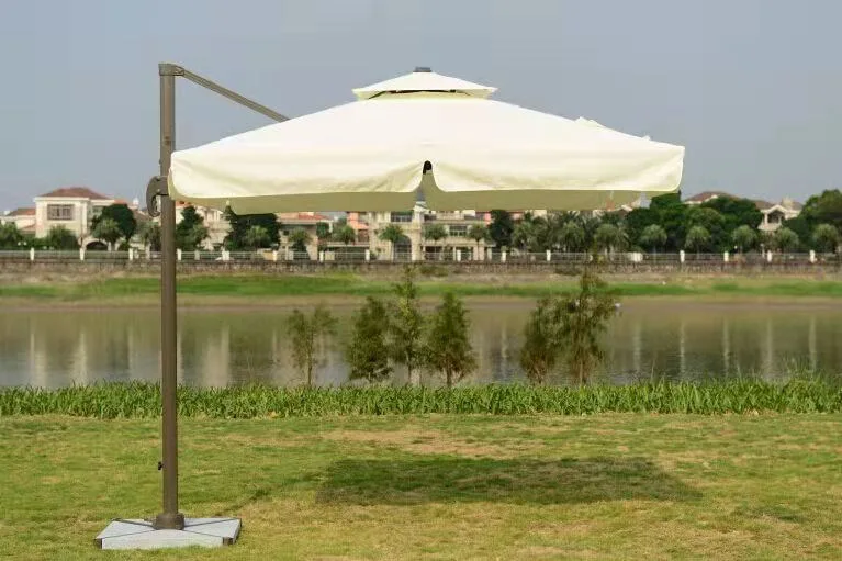 La plage de ronde de loisirs intérieur Lowes Patio extérieur définit avec parapluie