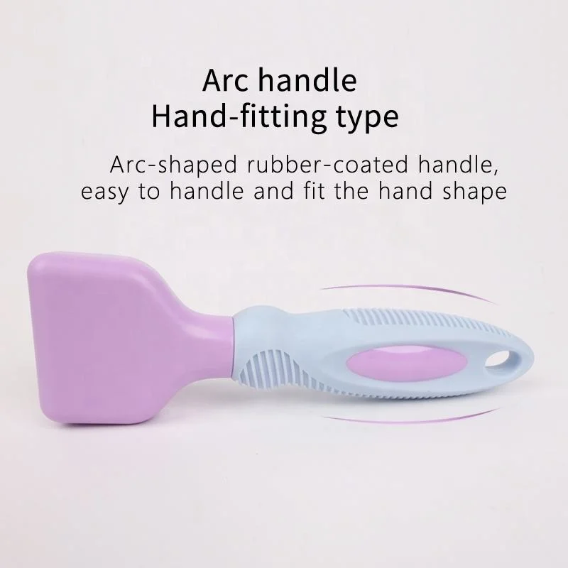 Nouvelle brosse de toilettage pour animaux avec ouverture pour nœud de cheveux.