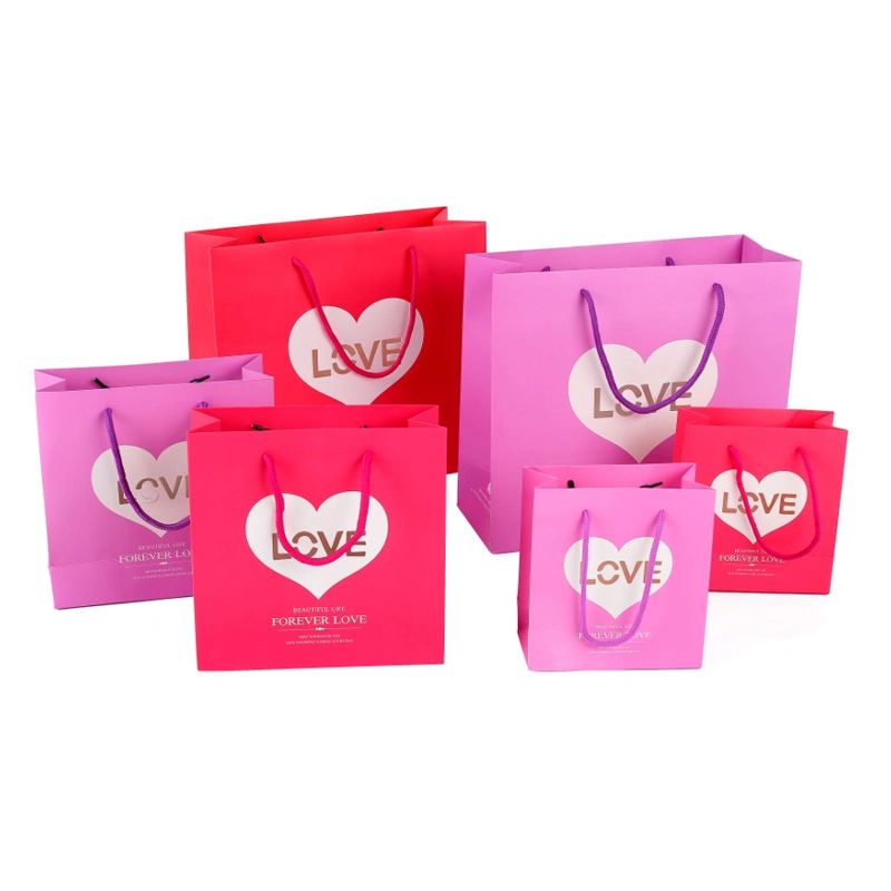 on Sale Stock Paper Gift Bags with Hollow out Love Design