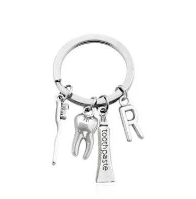 Custom Blank Dental Forcep Puffy Bottle Metal Souvenir Keychain for Business Gift