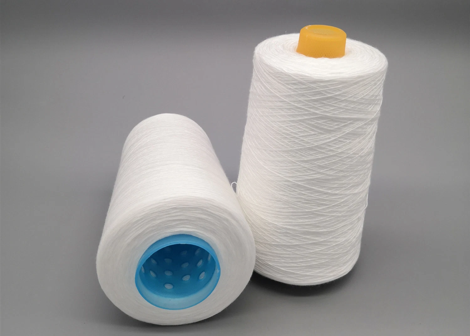 Polyester Thread Yarn 40/2 Micro Polyester Spun Yarn 20/2 Heat Set PP Sp 40/3 Sewing Thread Weaving Polyester Yarn 50/2