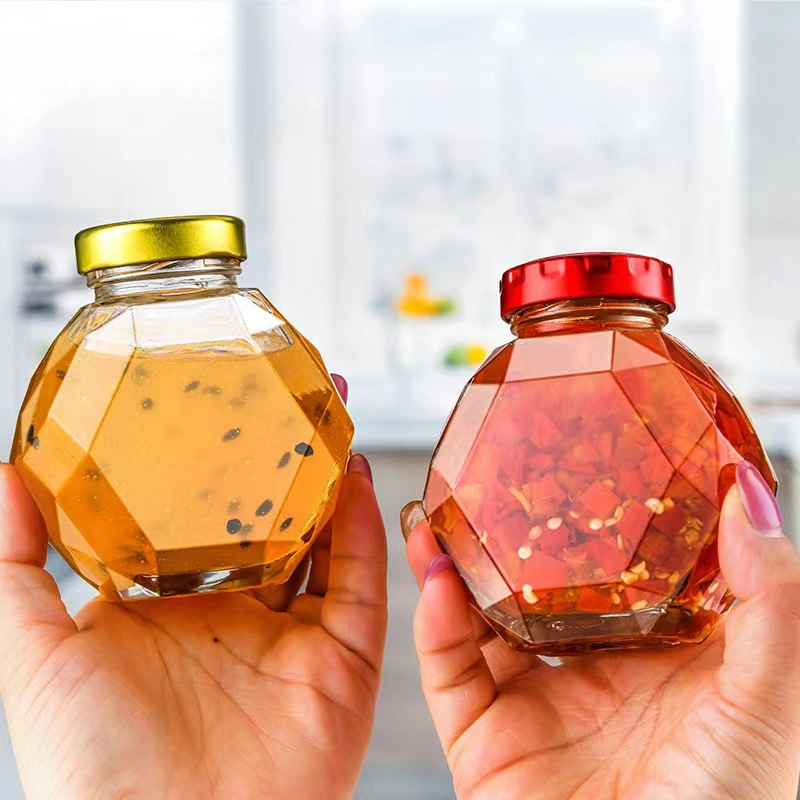 Huajing Hexagonal vacía la miel con el corcho de madera para uso alimentario los envases de vidrio sellados Hexagonal latas frascos de miel