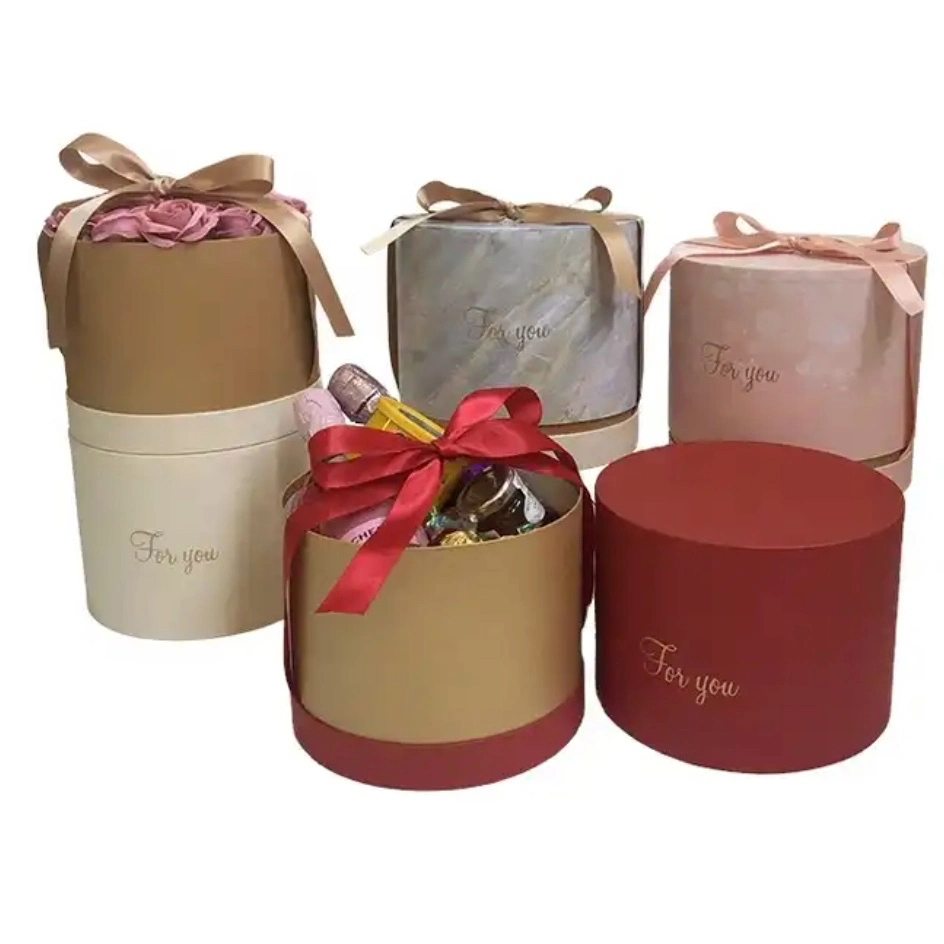 Caja de regalo redonda de gama alta con diseño de flores y una caja de regalo redonda