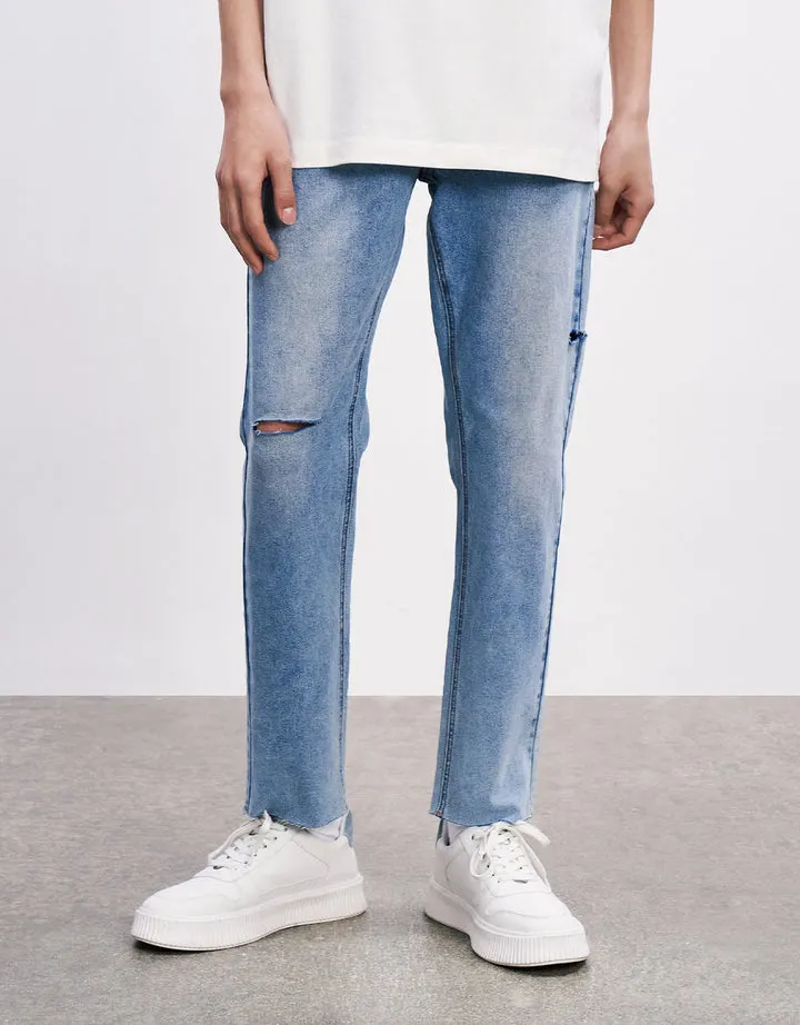 La mens ligero tramo azul lavado nieve roturas en la rodilla derecha pantalones skinny jeans de mezclilla dobladillo en bruto de la pierna