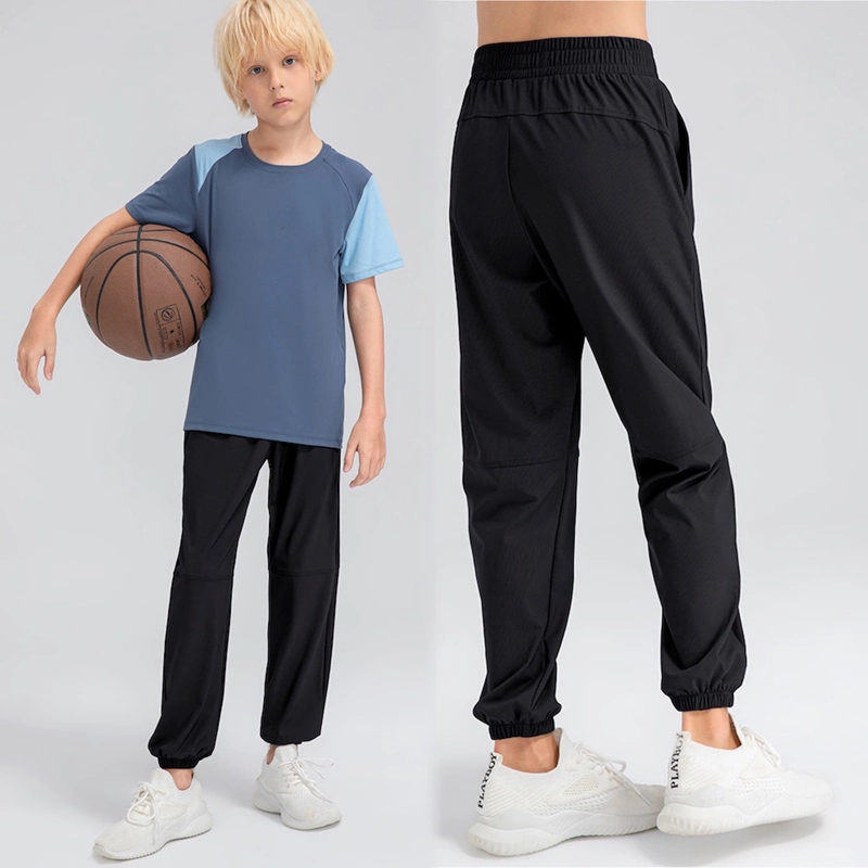 Pantalón de chándal informal de ajuste holgado con bolsillos laterales ligero para jóvenes Pantalón deportivo activo de secado rápido para niños