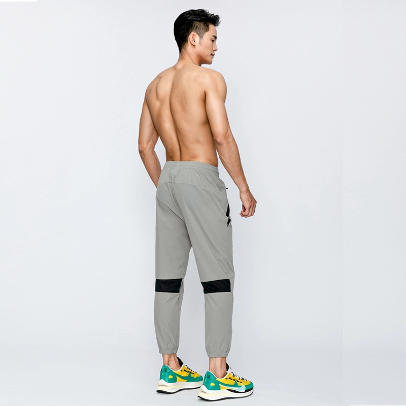 Calças de desporto nylon Gym Outdoor Stock Track Jogger Sweat para homem Calças Sportswear