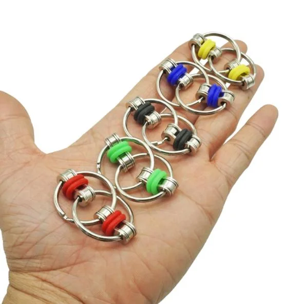 Barato 30mm lado metálico colorido Spinner Fidget Flippy Key Ring Corrente de rolo da corrente de bicicletas brinquedos para alívio de tensões