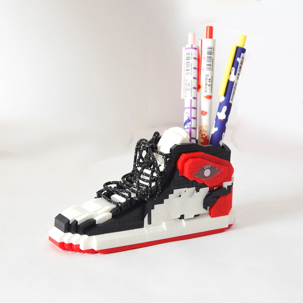 Zapatillas de Baloncesto Aj Contenedor de pluma de bloques de construcción de pequeñas partículas de adultos Infantiles puzzle montado Juguetes