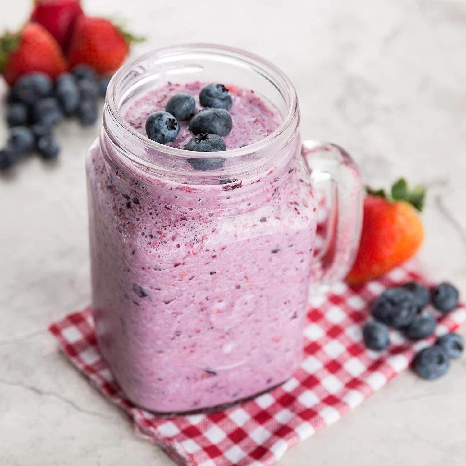 Pot en verre sans couvercle pour le stockage de yaourts et de smoothies.