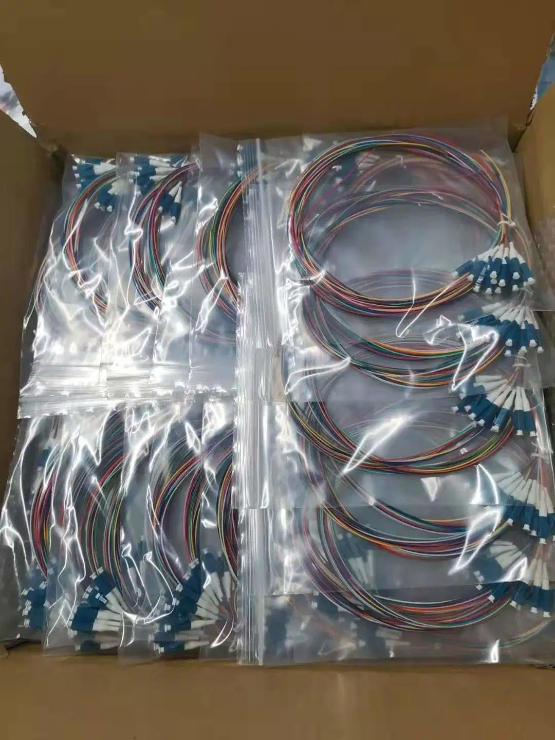 Manufacturer Supply Mini Pre-Terminated 12 Core Unjacketed Color-Coded Fiber Optic Pigtail for FTTH Communication