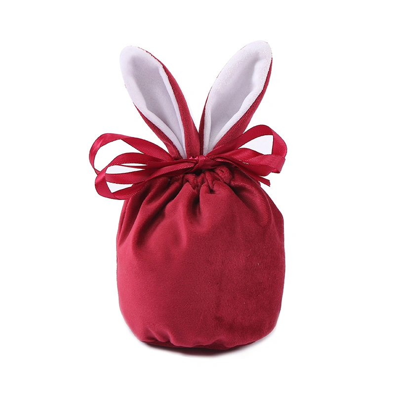 La Pascua Regalos y artesanías de conejito de peluche de caramelos de colores bolsa de regalo en el oído del conejo de chocolate