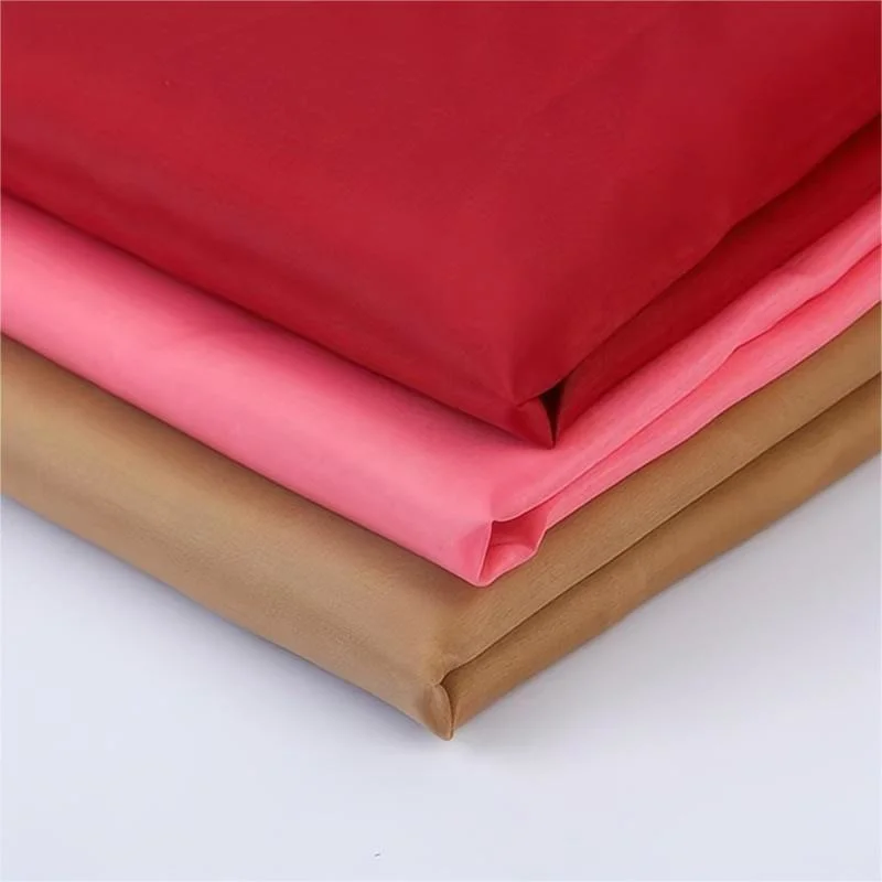 Wholesale/Supplier Factory Low Price 45g-62g 100% Polyester Taffeta Fabric Lining for Garment