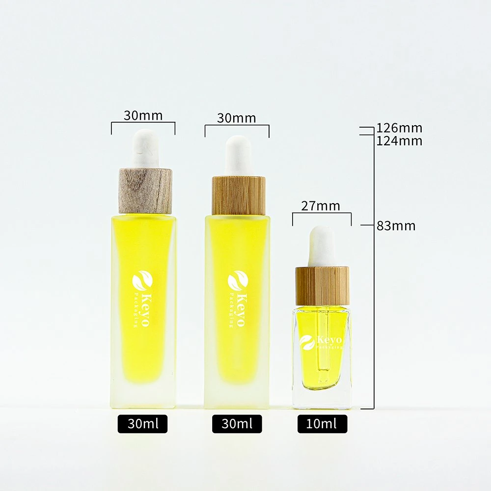 Flacons de soins de la peau, bouchon en bambou transparent en bois, flacon compte-gouttes en verre d'huile essentielle de 10 ml et 30 ml, emballage cosmétique.