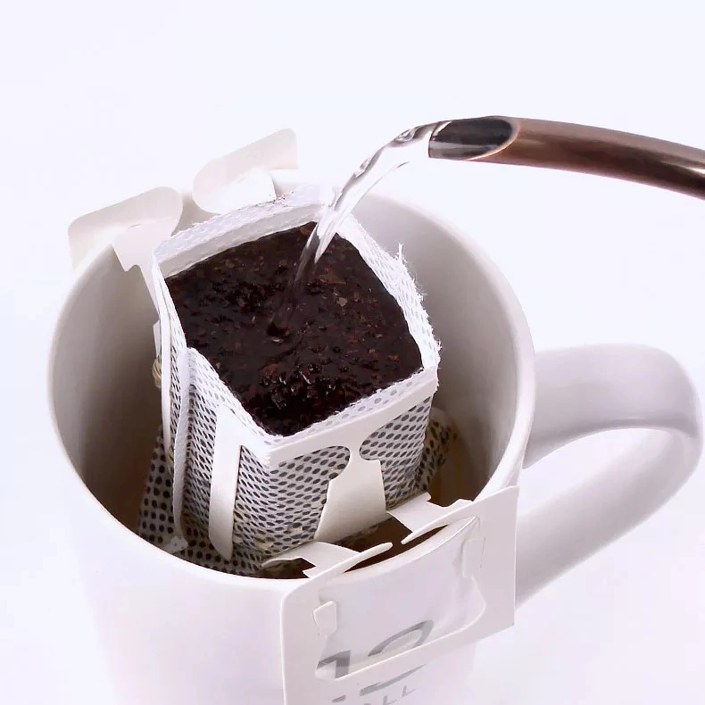 تقوم الشركات المصنعة بتزويد كيس ورق معلق مزود بالموجات فوق الصوتية بقهوة الأذن المعلقة كيس فلتر القهوة بالتقطير