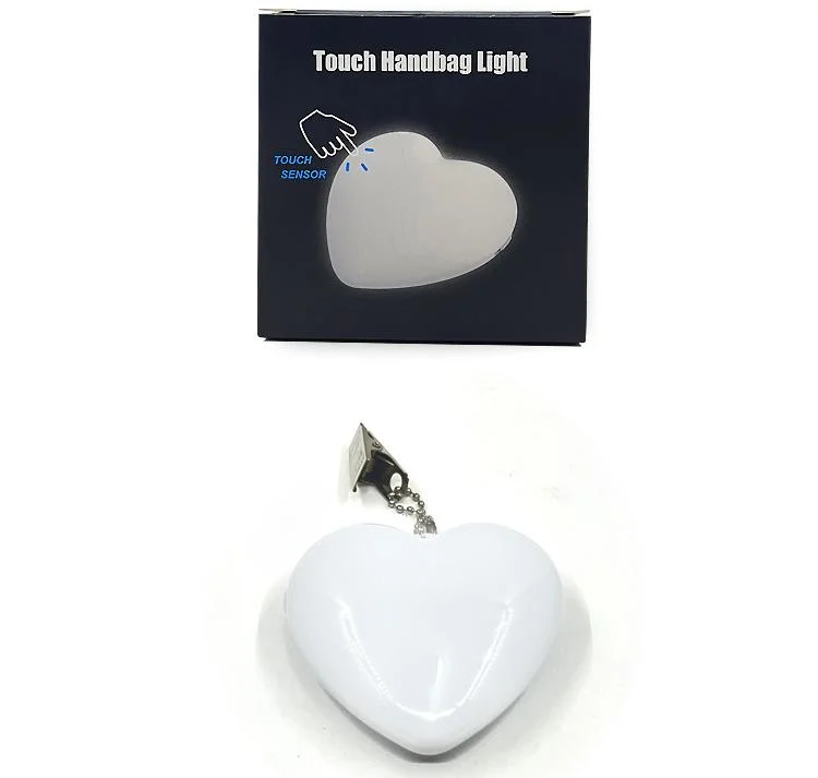 Nuevo portátil Mini batería de la luz de la bolsa de sensor automático del sensor de luz en forma de corazón Monedero caliente Romance Sensor táctil de la luz de noche