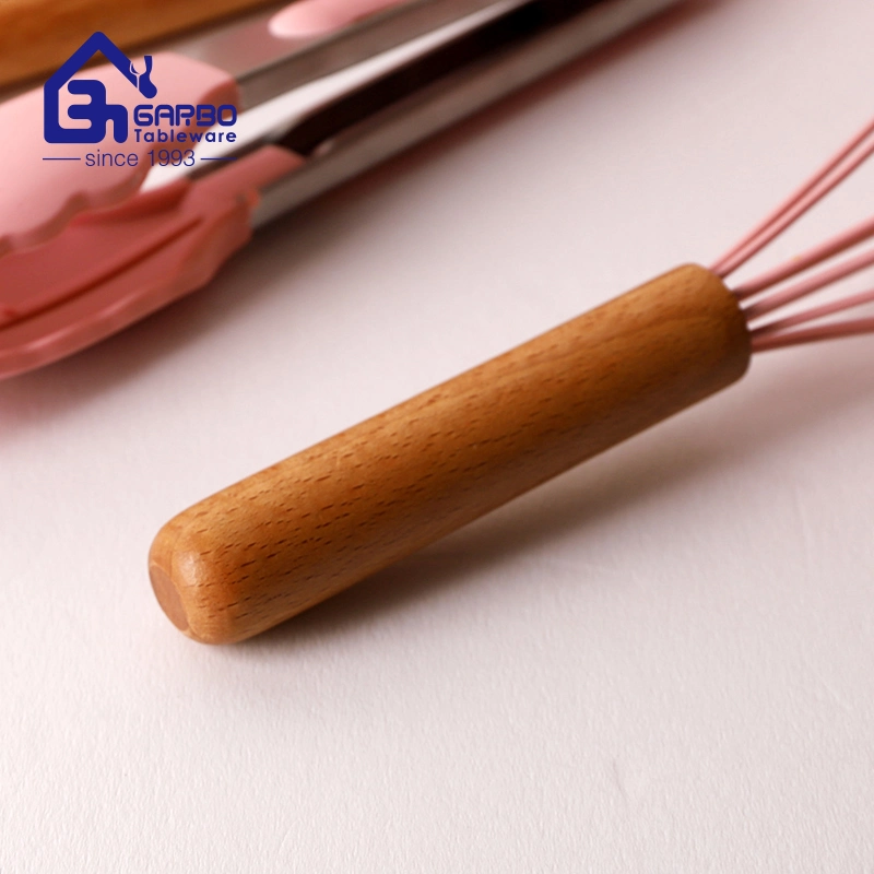 11PCS Ensemble de cuisine en nylon de couleur rose avec poignées en bois Outils de cuisson sûrs pour les aliments pour une utilisation en cuisine.