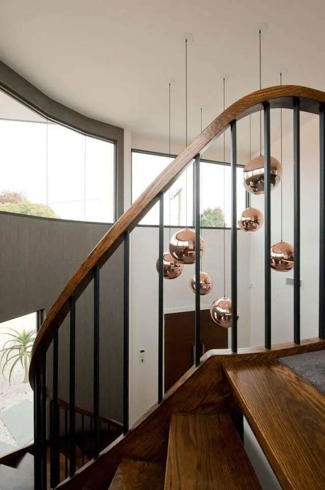 Interior Curved Staircase with Wrought Iron Balustrade